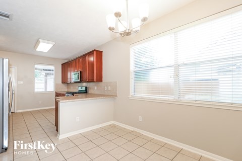 a kitchen with a sink and a large window