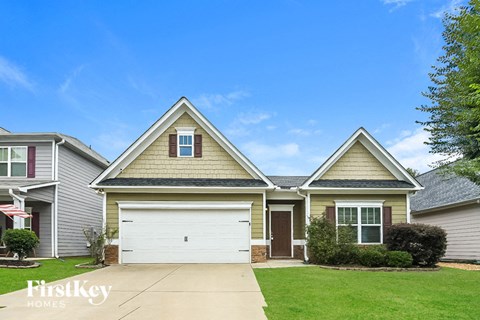 A house with a garage is for sale.