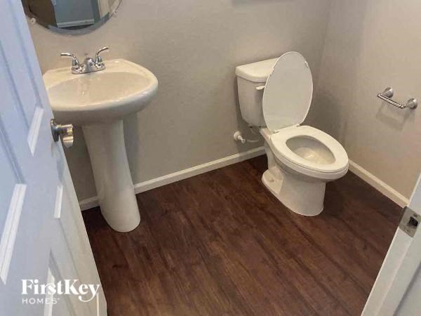 a bathroom with a toilet and a sink
