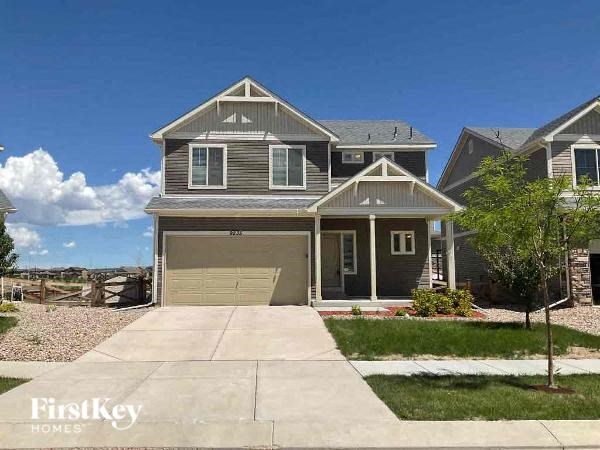 the front of a house with a garage door
