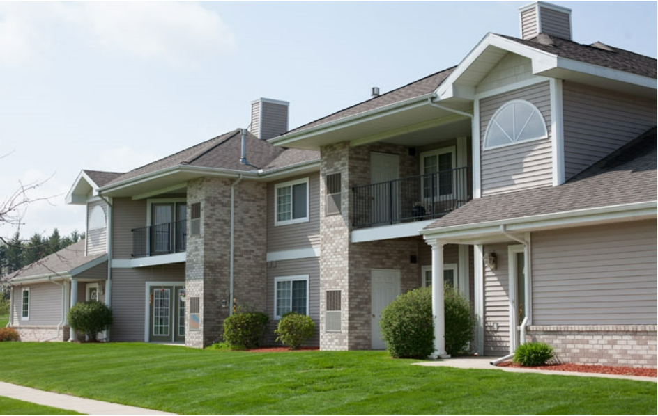 a large house with a lawn in front of it