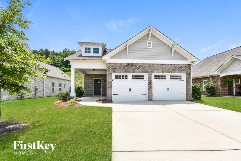 a house with a white garage door and a driveway