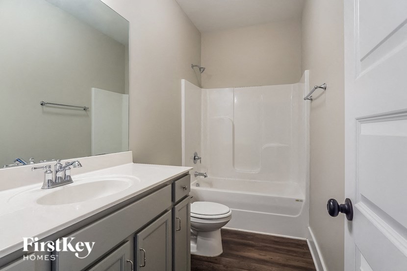 a bathroom with a sink toilet and a shower