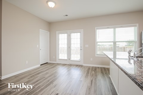 A kitchen with a sink and a window.
