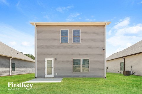 the exterior of a house with a grassy yard
