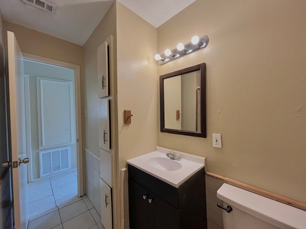 a bathroom with a sink and a mirror and a shower