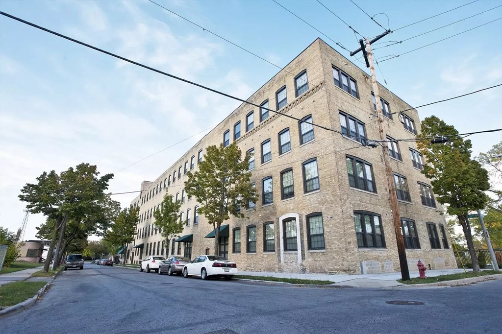 an old brick building on the corner of a street