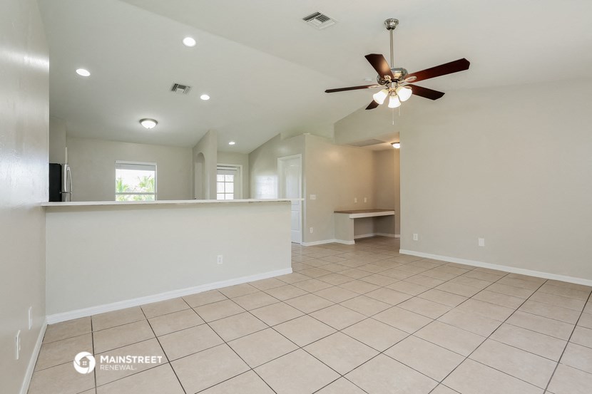 the kitchen is open to the living room and dining room
