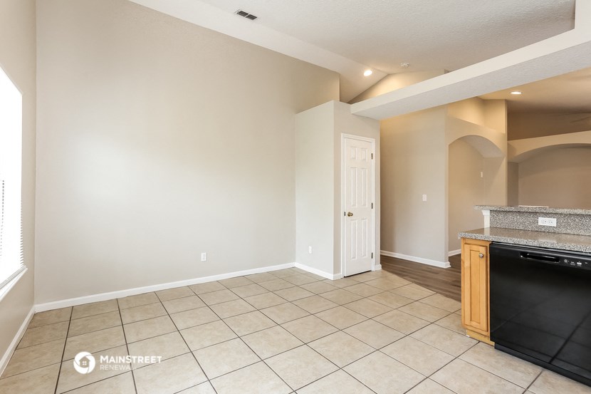 the kitchen and living room are empty and ready to be remodeled