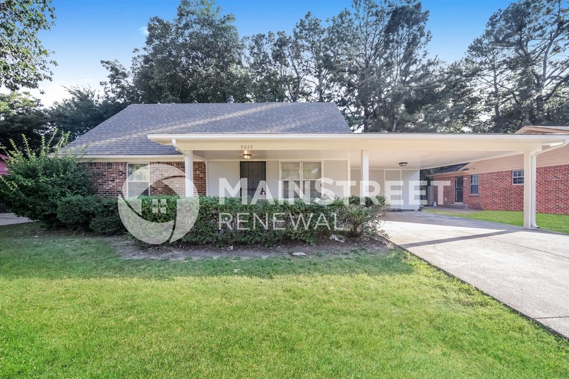a home with a lawn and a sign that reads renewal