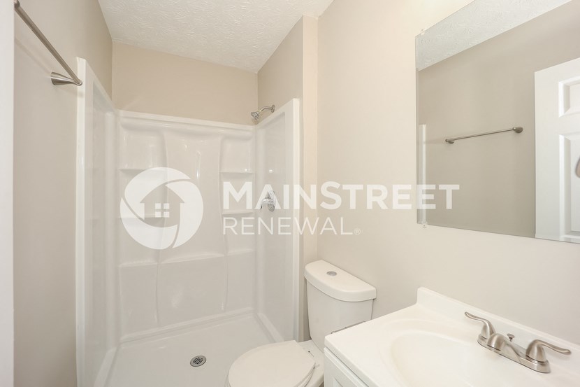 a small bathroom with a toilet and a sink