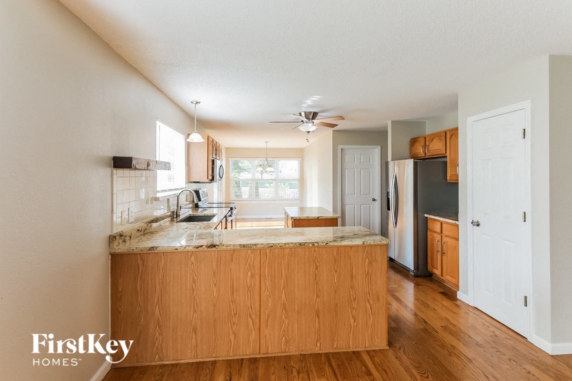 a kitchen with a counter top and a refrigerator