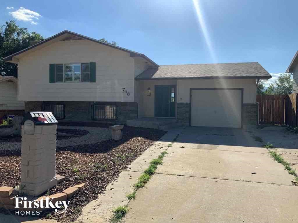 a house with a driveway and a garage door