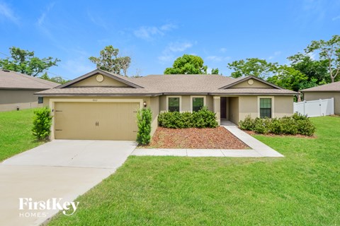 A house with a garage is for sale by FirstKey Homes.