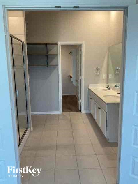 a bathroom with a sink and a shower