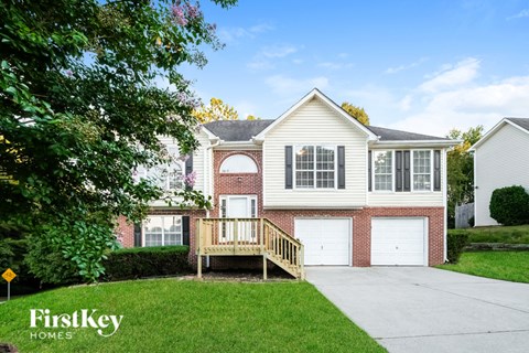 A house with a garage and a porch is shown in the image.
