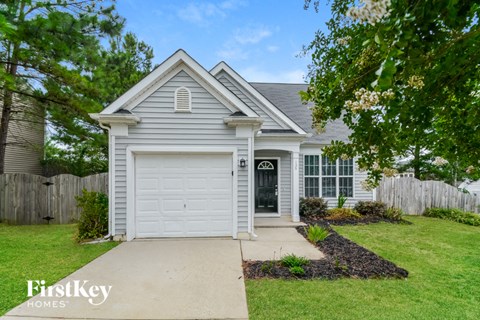 a white house with a white garage door