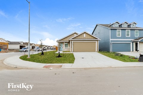 A residential area with houses and a clear sky.