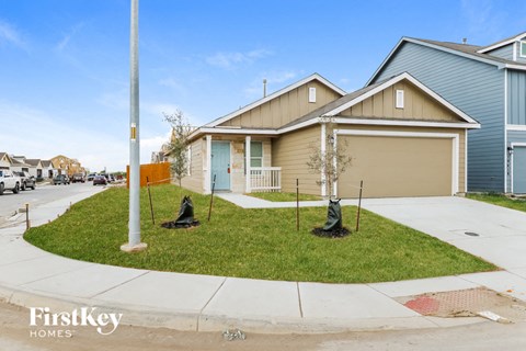 A house with a garage is for sale.