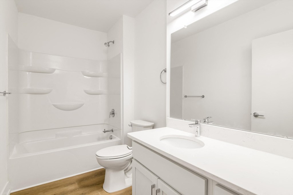 a bathroom with a sink toilet and a shower