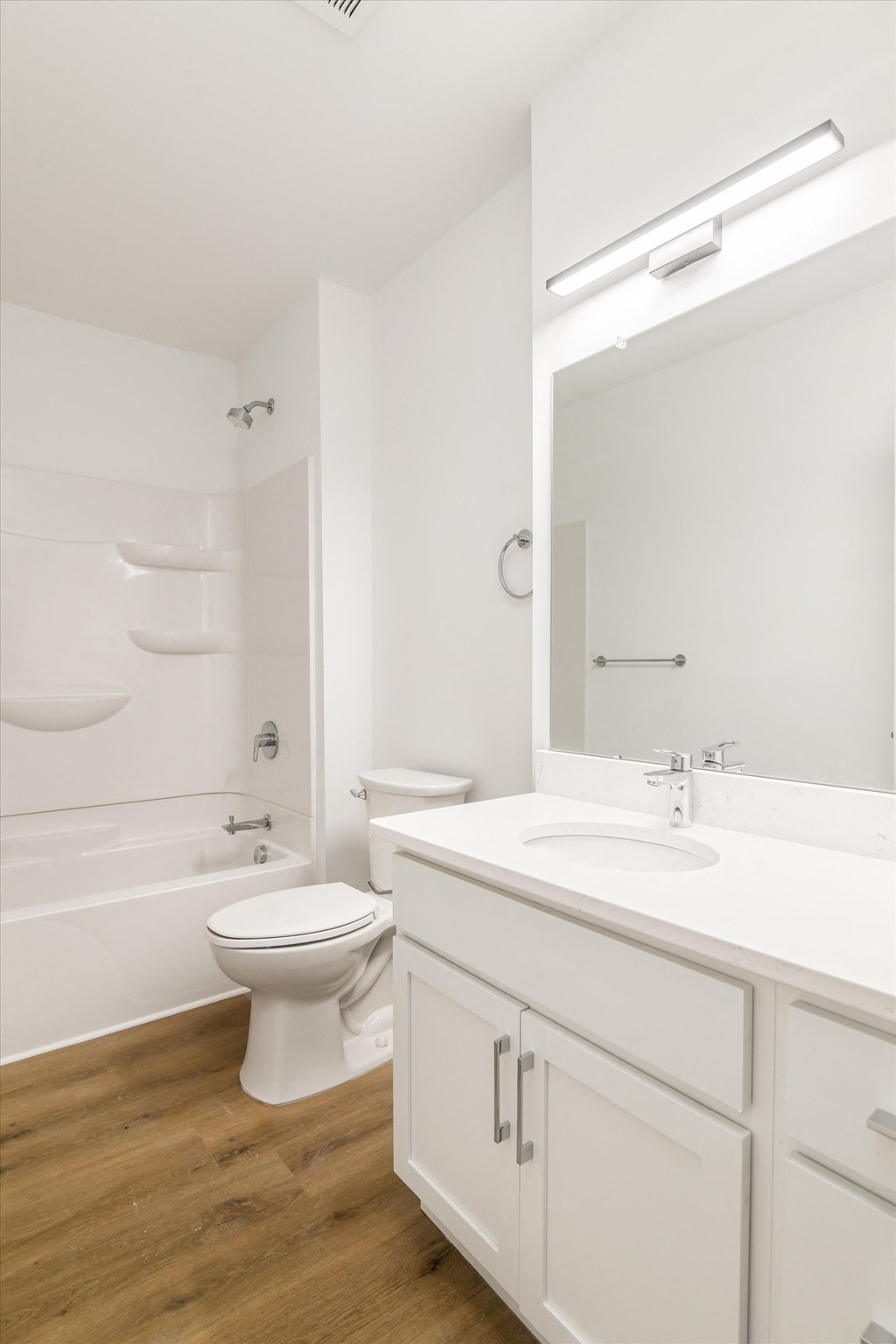 a bathroom with a toilet sink and a mirror