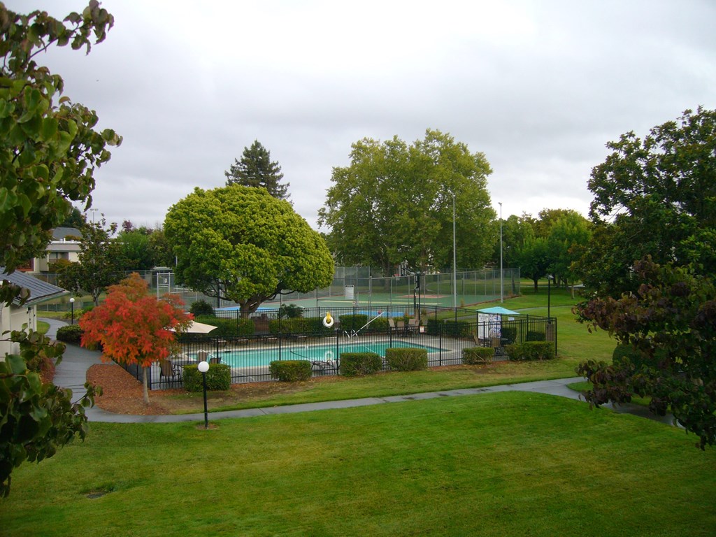 A view of a tennis court from a distance.