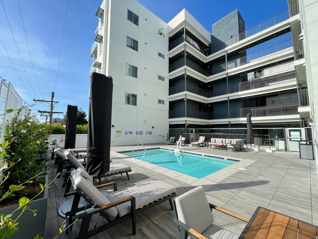 a swimming pool in front of a building