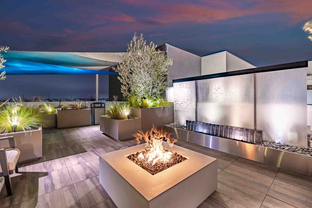 a fire pit on the terrace of a condominium