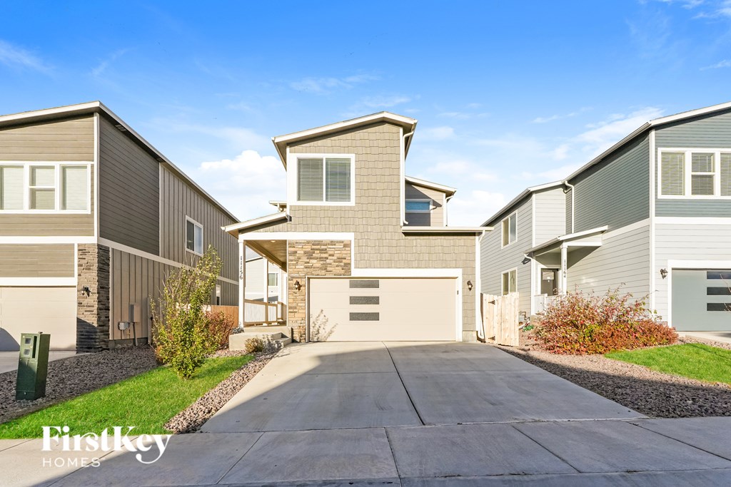 A row of houses with the first key homes logo on the bottom left.