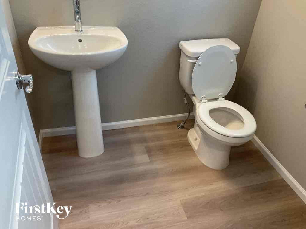 a bathroom with a toilet and a sink