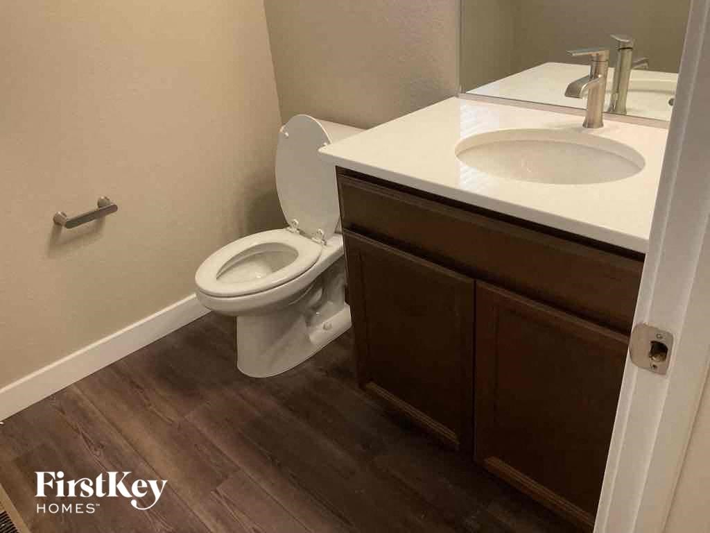 a bathroom with a toilet and a sink