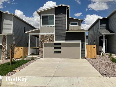 a house with a driveway and a garage door