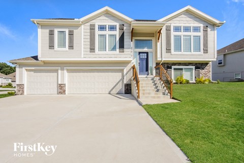 a large house with a driveway in front of it