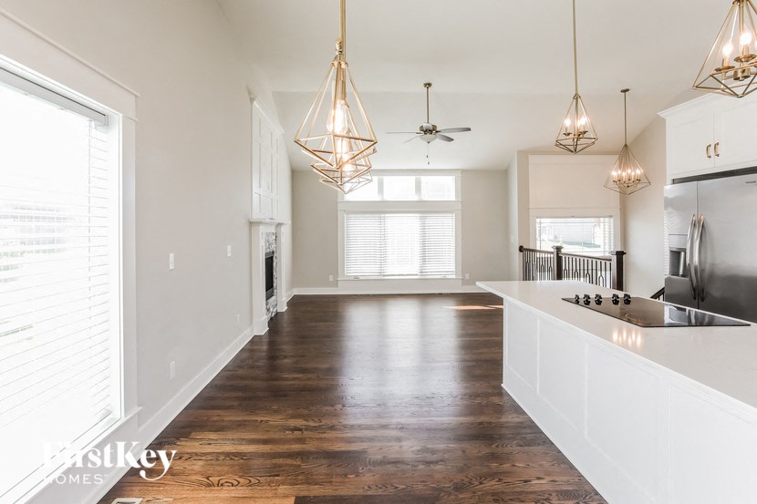 a kitchen and living room in a new home