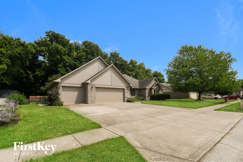 a house with a driveway and a garage door