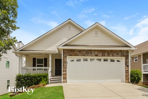 a white house with a white garage door