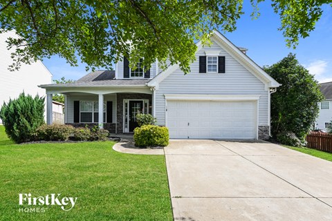 a white house with a white garage door