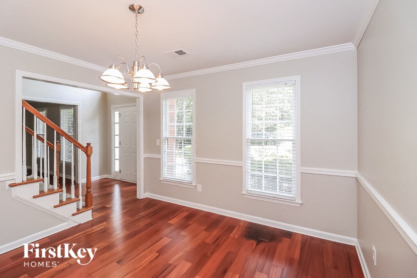 a view of the entryway and living room from the dining room