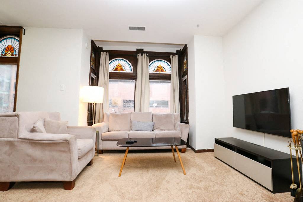 a living room with two couches and a television