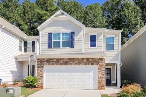 a white house with a white garage door