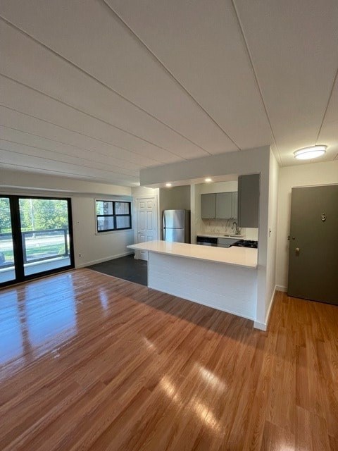 A kitchen with wooden floors and a countertop.