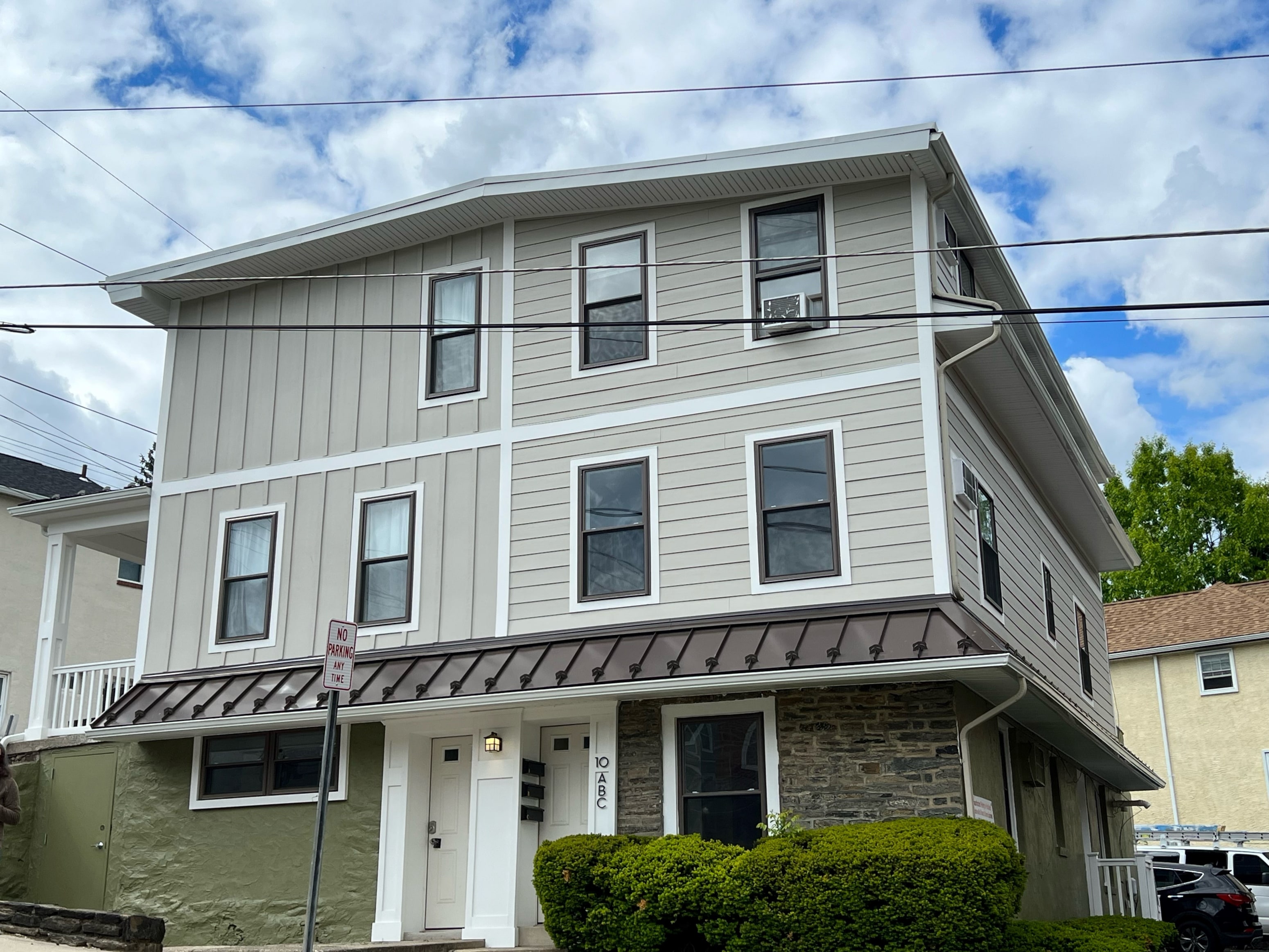 A two-story house with a grey and white exterior.