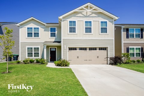 A large house with a garage is for sale by FirstKey Homes.