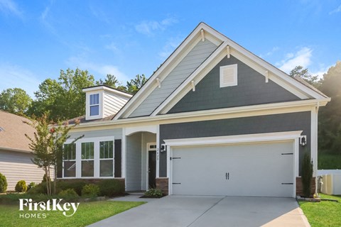 a gray house with a white garage door