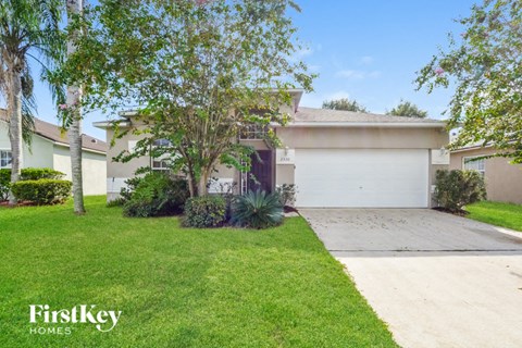 a house with a driveway and a garage door