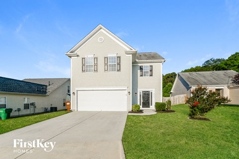 a white house with a white garage door