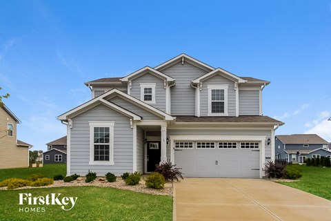 A house with a garage is for sale by FirstKey Homes.