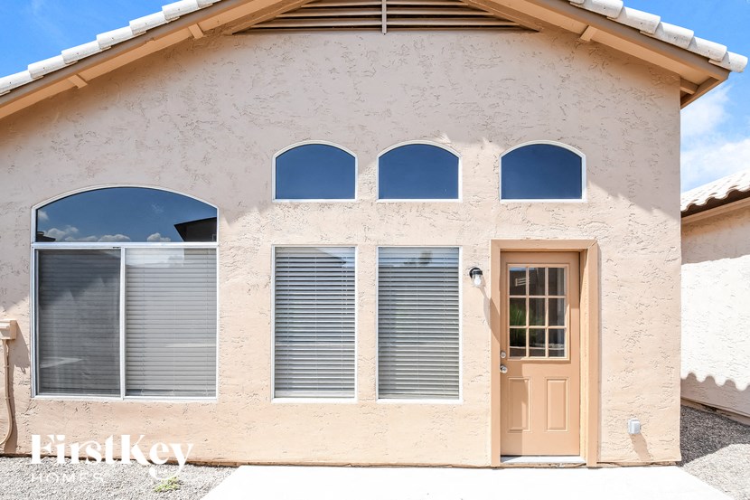 the front of a building with a door and windows