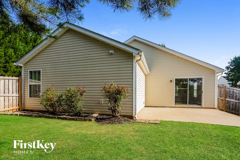 the exterior of a house with a yard and a driveway