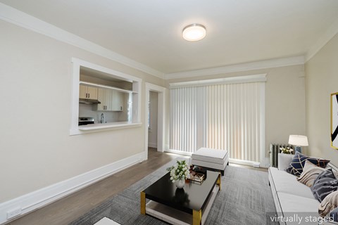 A living room with a coffee table and a couch.
